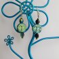 Iridescent black aqua AB Czech glass full moon face bead earrings