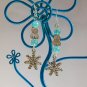 Cat snowflake charm aqua blue crackle bead earrings