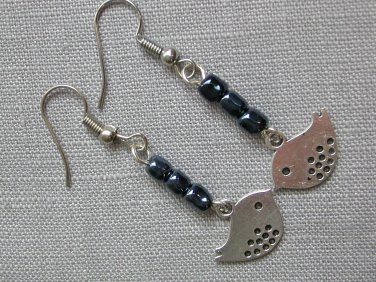 Silver bird charm grey glass bead earrings