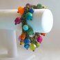 Chunky colorful rainbow bead stretch bracelet connected by metal chain