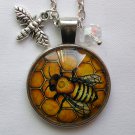 Bumble Bee on hive cabochon charm pendant necklace Bumble Bee on hive cabochon charm pendant necklace