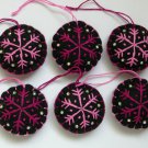 Handmade pink fuchsia snowflake felt ornament on black lot