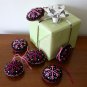Handmade pink fuchsia snowflake felt ornament on black lot