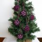 Handmade pink fuchsia snowflake felt ornament on black lot