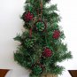 Handmade red and green snowflake felt ornaments on black lot