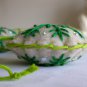 Handmade light and dark green snowflake felt country ornament on brown lot