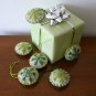 Handmade light and dark green snowflake felt country ornament on brown lot