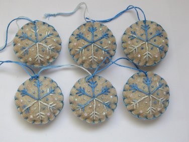 Handmade ombre blue snowflake felt country ornament on brown lot