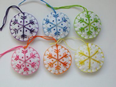Handmade rainbow colorful snowflake felt ornament on white lot