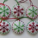Handmade green and red classic snowflake felt ornament on white lot