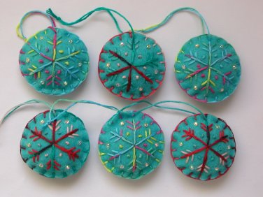 Handmade red pink blue snowflake felt ornament on aqua lot