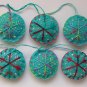 Handmade red pink blue snowflake felt ornament on aqua lot