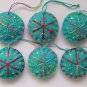 Handmade red pink blue snowflake felt ornament on aqua lot
