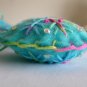 Handmade red pink blue snowflake felt ornament on aqua lot