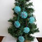Handmade red pink blue snowflake felt ornament on aqua lot