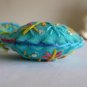 Handmade yellow blue rainbow snowflake felt ornament on aqua lot
