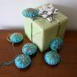 Handmade yellow blue rainbow snowflake felt ornament on aqua lot