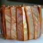 Orange dyed shell iridescent abalone stretch bracelet