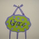 Green with purple polka dots.