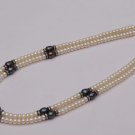 Pearls mala of Oval Shaped Black Pearls & White Pearls