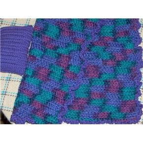Hand crocheted Doll blanket in purples with a purple pillow
