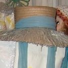 Island style vintage straw hat with pale teal colored detail and ties