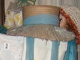 Island style vintage straw hat with pale teal colored detail and ties