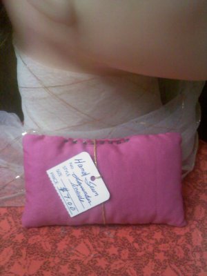 Vintage pink cotton sachet hand-stitched with brown decorative stitches
