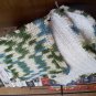 Hand crocheted hot pads (2) and a dish cloth of cotton yarn in teal greens cream