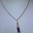 huge purple amethyst color emerald-cut stone set in goldtone 1975 "Plaza IV" necklace