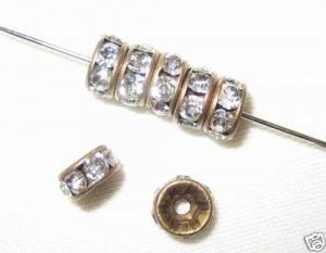 100 Swarovski Rondelle Spacer 4mm Antique Brass/Crystal