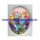PARAKEET BUDGIE BIRD WITH COLORFUL PANSY * UNSET CAMEO PORCELAIN CAB 18X25MM