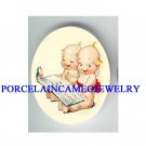 2 KEWPIE BABY READING BOOK ROBIN BIRD PORCELAIN CAMEO
