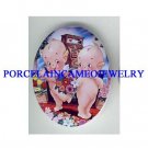2 KEWPIE BABY WITH FLOWER CAMEO PORCELAIN CAB 18X25MM