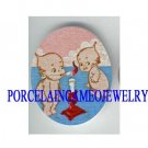 2 KEWPIE BABY BLOW CANDLE* UNSET CAMEO PORCELAIN CAB
