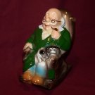 VINTAGE GRANDPA MAN W/DOG & PIPE ROCKING CHAIR RETIREMENT FUND BANK - JAPAN