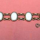 Vintage bracelet gold-tone links 6 white oval stations ll1912