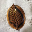 Stylized leaf on oval disk copper pin brooch mid century vintage ll2463