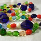 Jewel toned glass bead necklace 56 inch rope brilliant colors perfect vintage ll2592