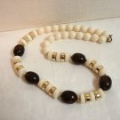Mixed Lucite plastic bead necklace white, root beer, gold opera length vintage ll3254