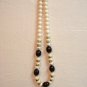 Mixed Lucite plastic bead necklace white, root beer, gold opera length vintage ll3254