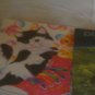 a magazines and colored book and a folder