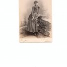Vintage Photo Young Woman Leaning On Statue With Flowers And Trees In Back Ground On Card Stock