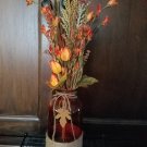 Orange Bottle, Jute & metal leaf w/ Orange buds, berries, Green, Brown & Cream Wheat w/ glass rocks