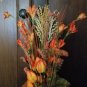 Orange Bottle, Jute & metal leaf w/ Orange buds, berries, Green, Brown & Cream Wheat w/ glass rocks