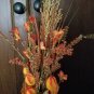Amber Bottle, Jute & metal leaf w/ Orange buds, berries, Green, Brown & Cream Wheat w/ glass rocks