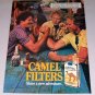 1987 Camel Cigarettes Arm Wrestling Color Print Ad with Pregnancy Warning
