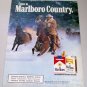 1986 Marlboro Cigarettes Cowboy Winter Themed Color Tobacco Ad
