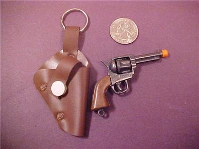 VINTAGE MINIATURE REVOLVER CAP GUN WITH HOLSTER