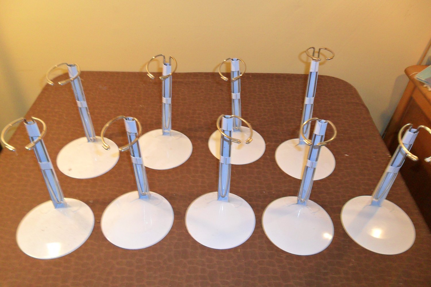 9 High Quality Doll Stands for Dolls 20-26 14-18 Inches Tall all in like new condition.